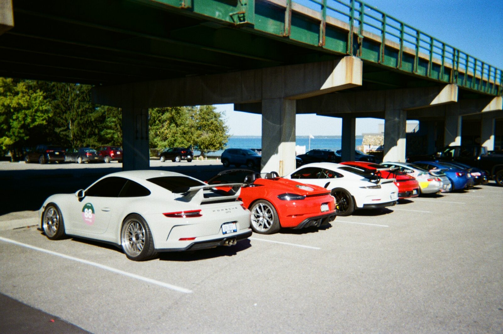 Rally cars lined up near the Mackinac Bridge